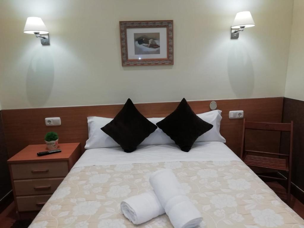 Cama o camas de una habitación en Pensión San Jerónimo