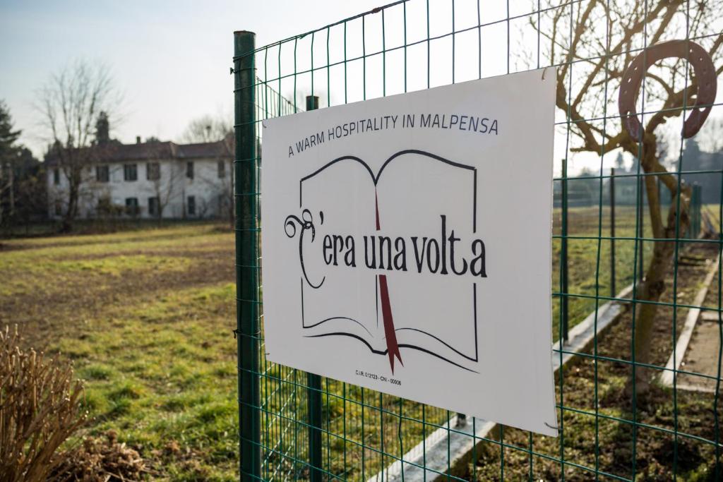 a sign on a fence that reads open ultra viola at C'era una volta room in Case Nuove