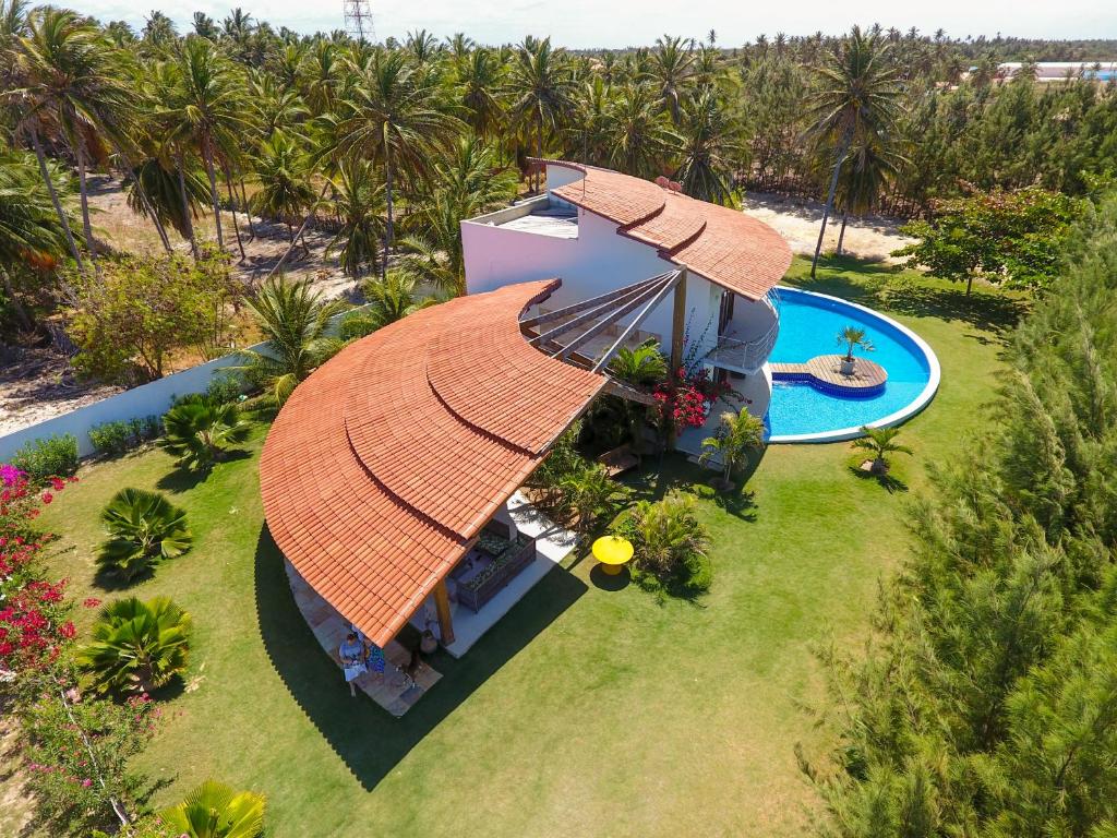 an aerial view of a house with an orange roof at Refúgios Parajuru - Villa Cacau in Parajuru