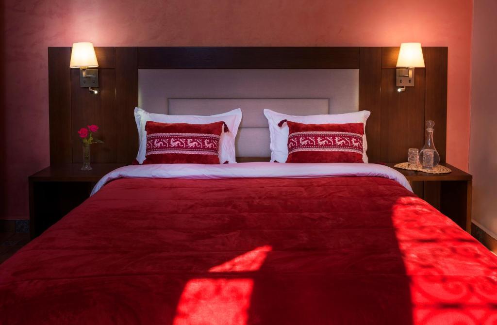 Postel nebo postele na pokoji v ubytování La Citadelle Marrakech