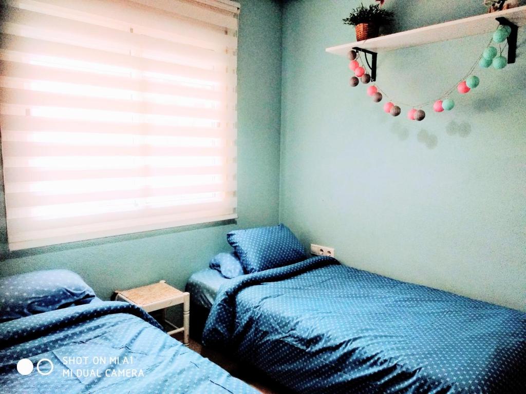 Postel nebo postele na pokoji v ubytování Nuestra Casa en Gran Alacant