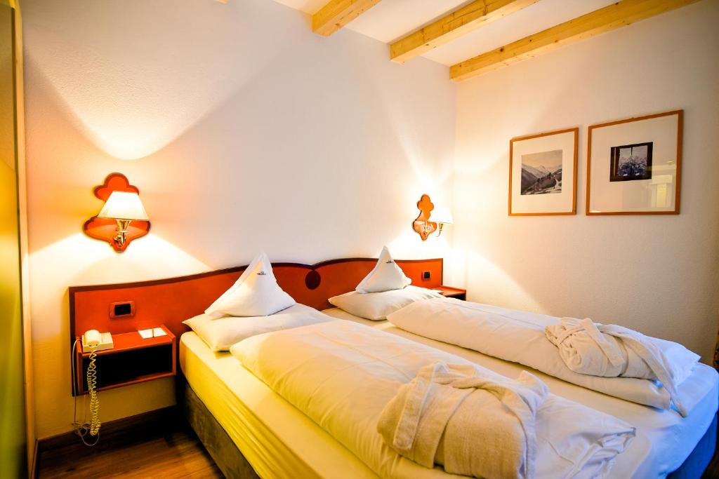Posteľ alebo postele v izbe v ubytovaní Parkhotel Tirolerhof