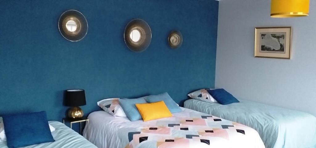 Ένα ή περισσότερα κρεβάτια σε δωμάτιο στο les Hortensias