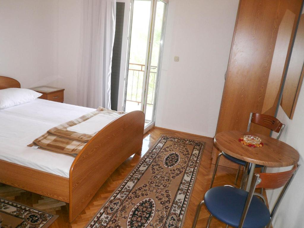 Postel nebo postele na pokoji v ubytování Apartments Šarić