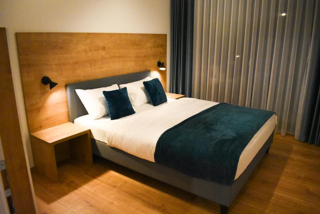 Postel nebo postele na pokoji v ubytování Apartmány Runi