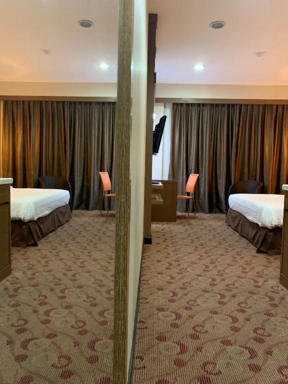 Postel nebo postele na pokoji v ubytování Sento Hotel