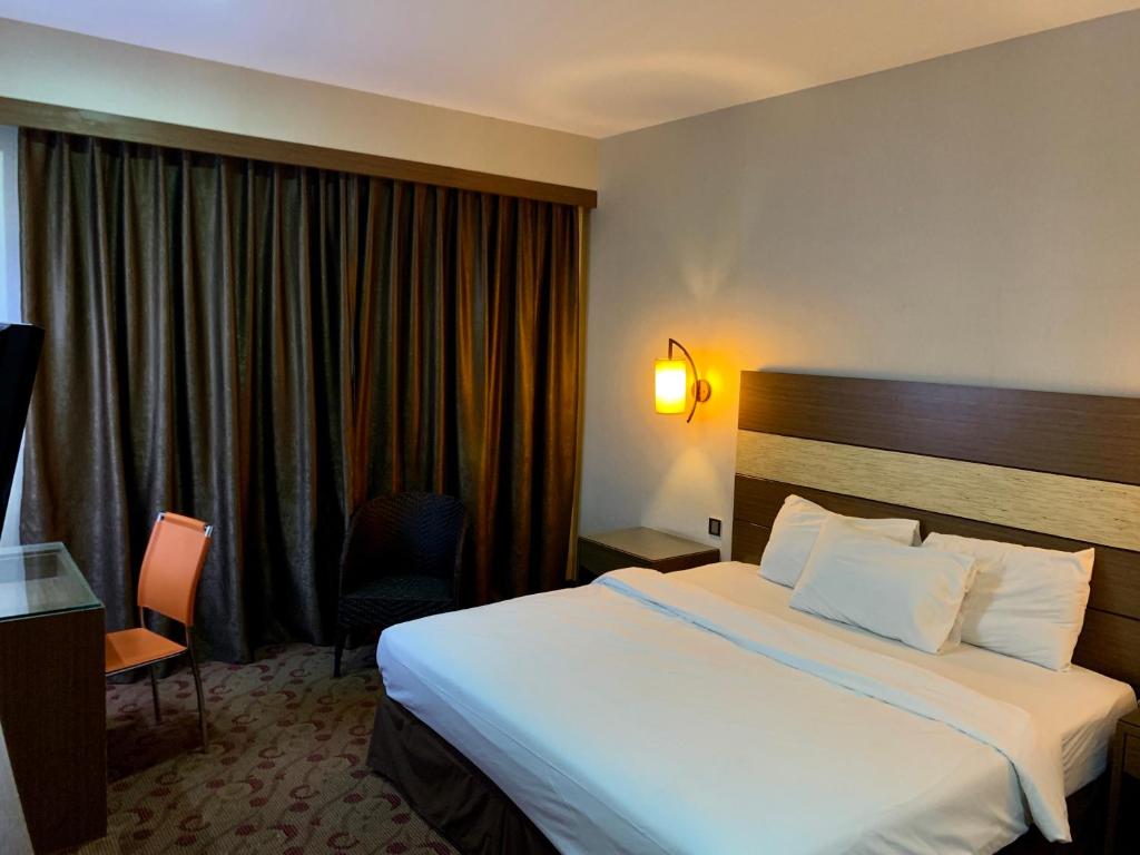 Postel nebo postele na pokoji v ubytování Sento Hotel