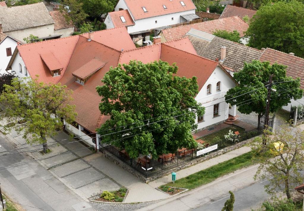 an overhead view of a white house with red roofs at Rácz Fogadó in Kisoroszi