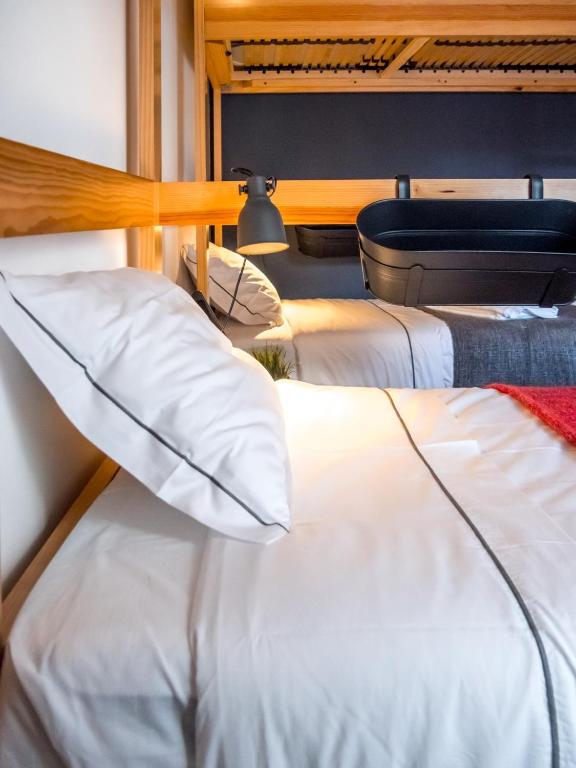 Postel nebo postele na pokoji v ubytování Procyon Boutique & Suites