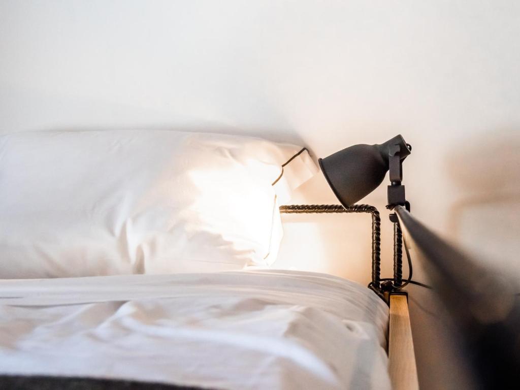 Postel nebo postele na pokoji v ubytování Procyon Boutique & Suites