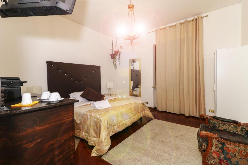 Postel nebo postele na pokoji v ubytování Vitti's Home Verona