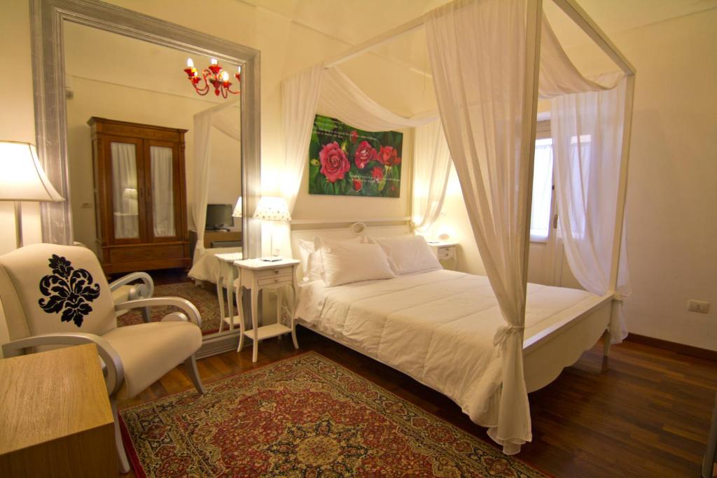Un pat sau paturi într-o cameră la La Via della Giudecca