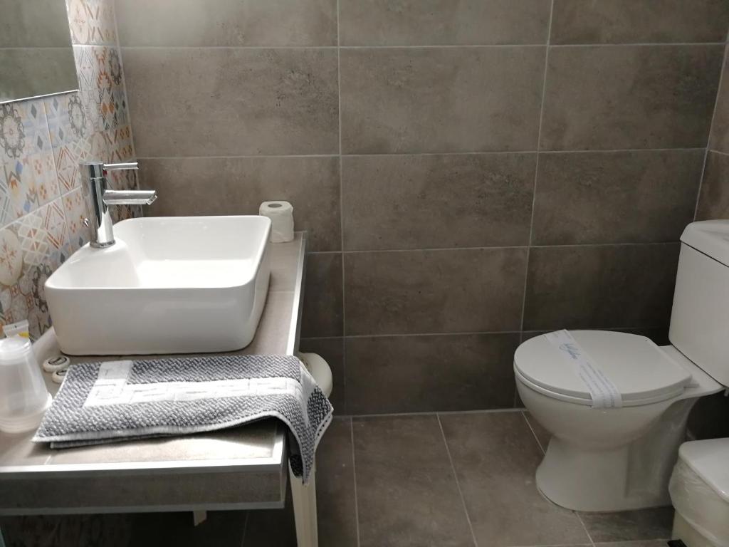 Koupelna v ubytování Helena Hotel