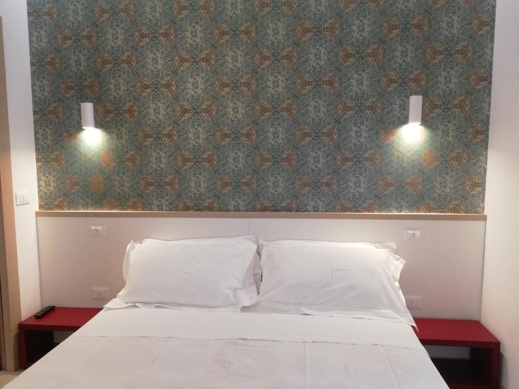Postel nebo postele na pokoji v ubytování Milan Residence