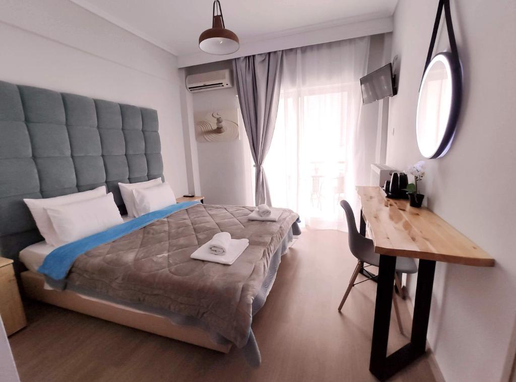 A bed or beds in a room at Moudania Mare Hotel