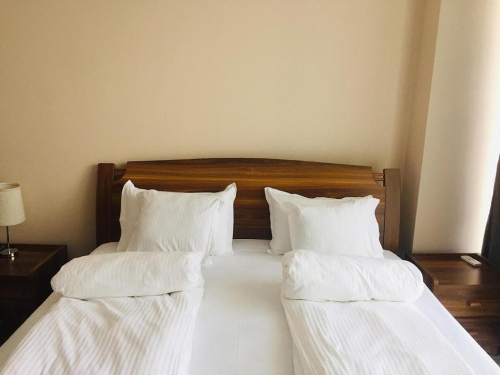 Postel nebo postele na pokoji v ubytování Hotel Lazi