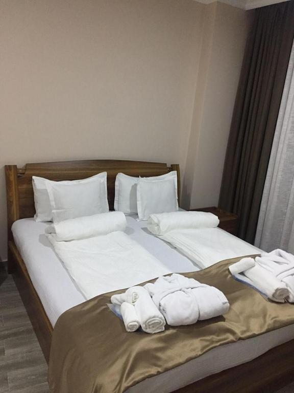 Postel nebo postele na pokoji v ubytování Hotel Lazi