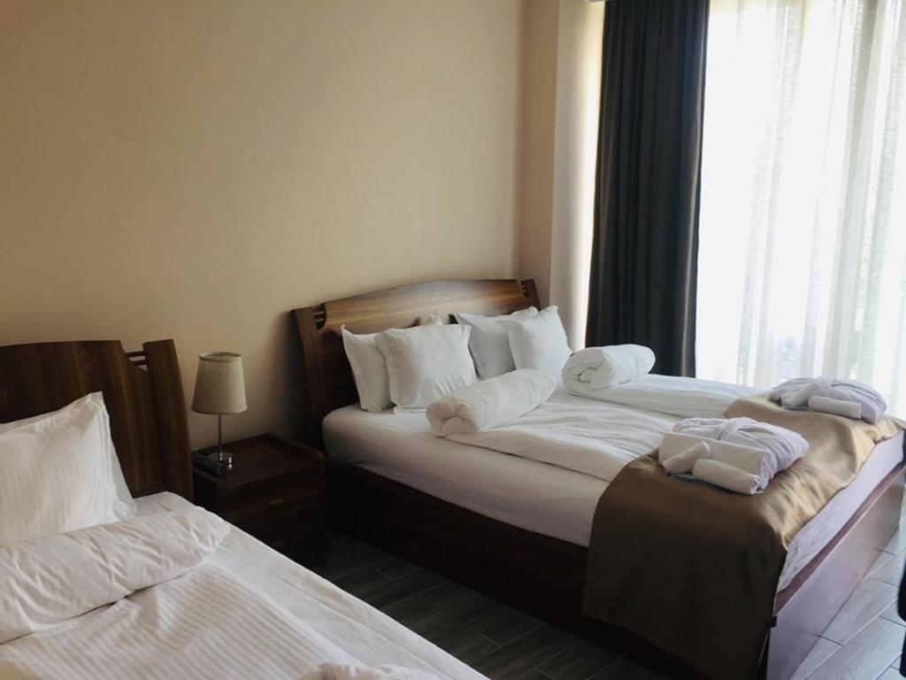 Postel nebo postele na pokoji v ubytování Hotel Lazi