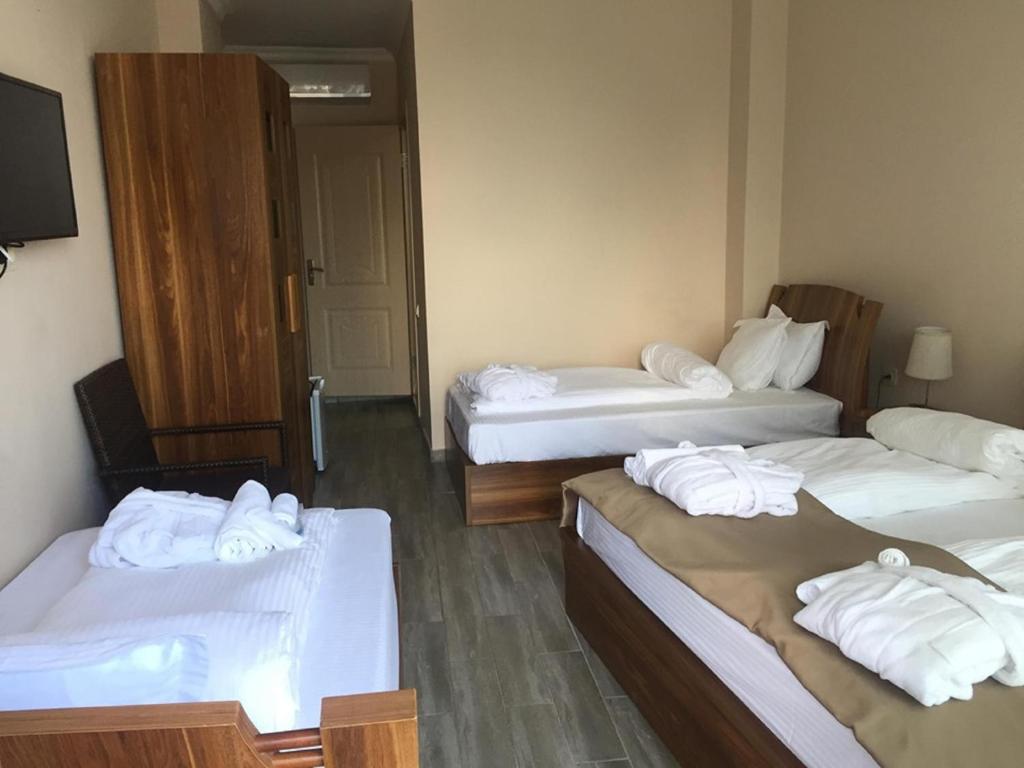 Postel nebo postele na pokoji v ubytování Hotel Lazi