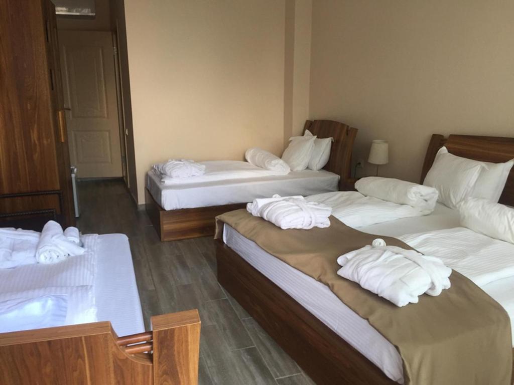 Postel nebo postele na pokoji v ubytování Hotel Lazi