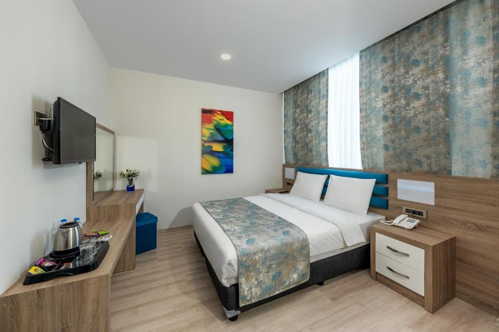 Postel nebo postele na pokoji v ubytování Anelli Hotel