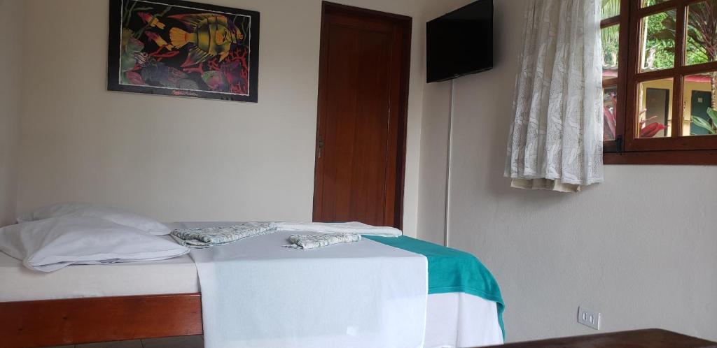 Postel nebo postele na pokoji v ubytování Pousada Mixirica