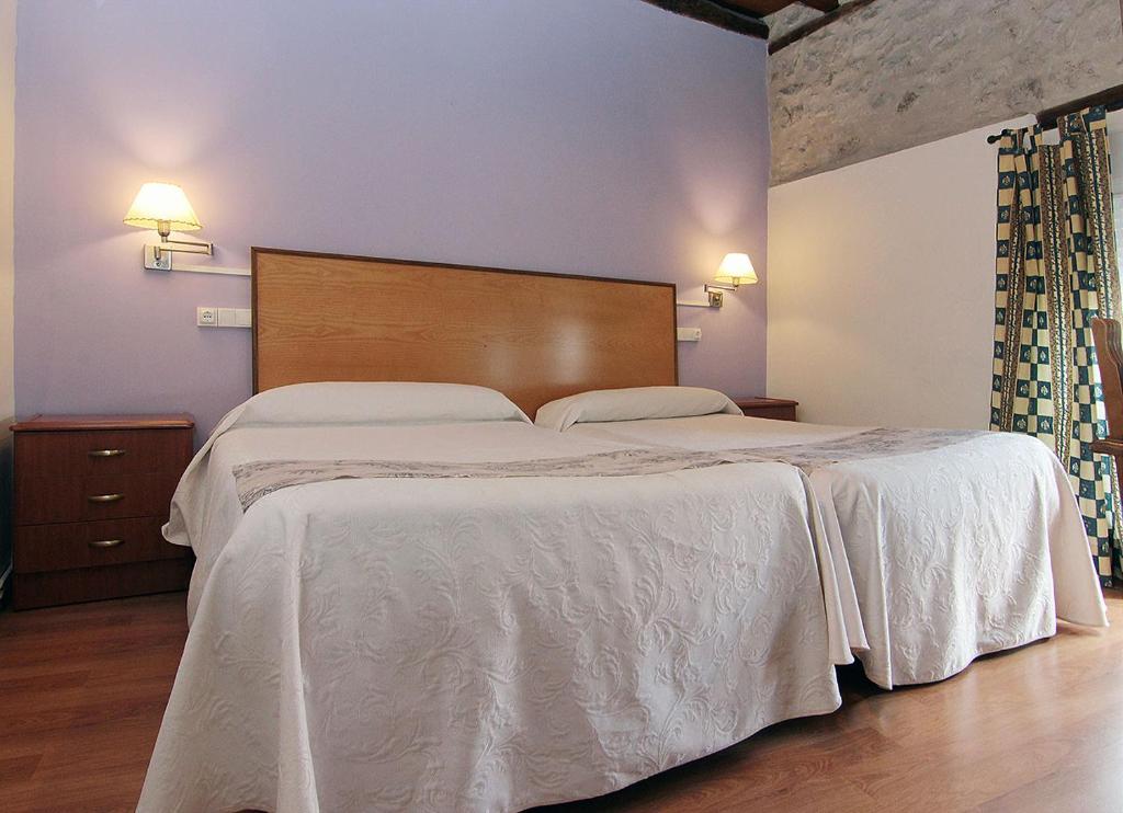 Posteľ alebo postele v izbe v ubytovaní HOTEL RURAL LOS ABUELOS