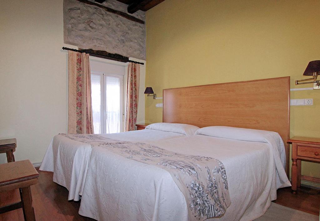 Posteľ alebo postele v izbe v ubytovaní HOTEL RURAL LOS ABUELOS