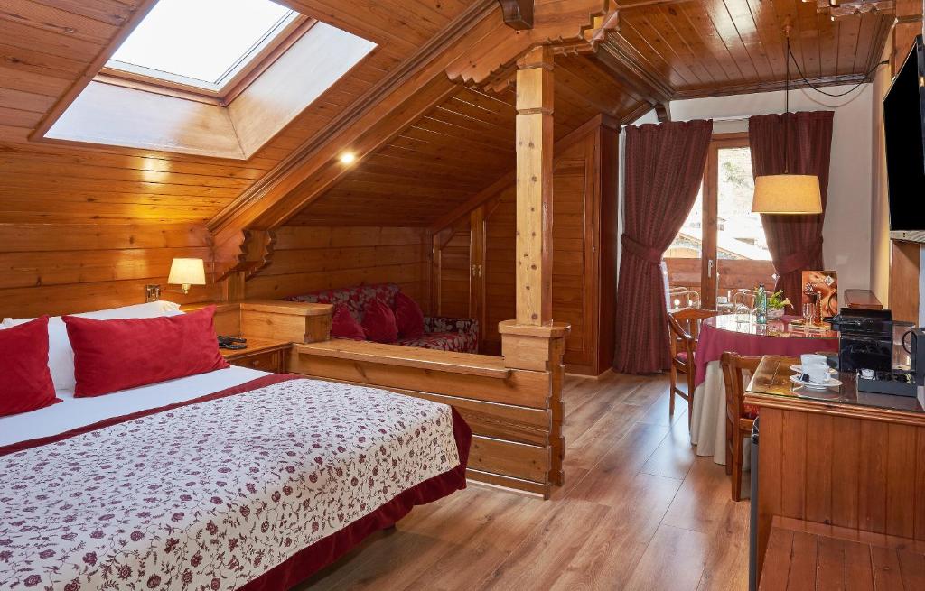 Postel nebo postele na pokoji v ubytování Hotel Grèvol Spa