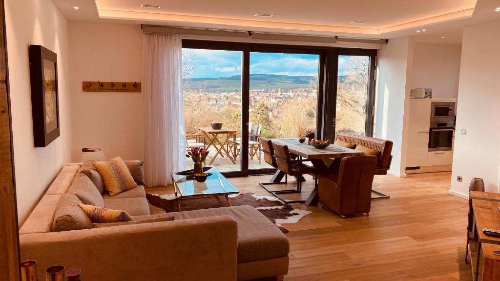 a living room with a couch and a table at the Lodge in Bad Sobernheim