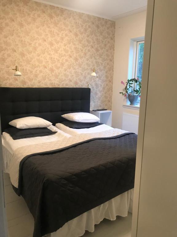 Postel nebo postele na pokoji v ubytování Sjövillan B&B