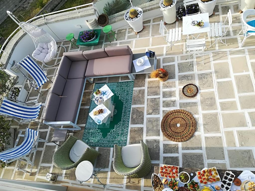 an overhead view of a patio with chairs and tables at Le Terrazze in Otranto