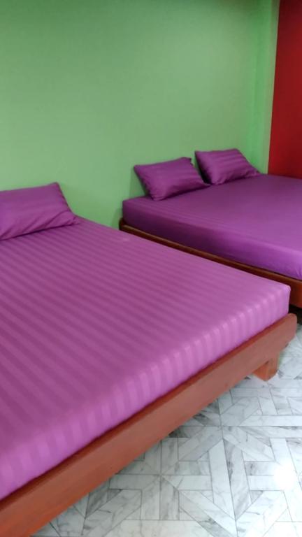 Postel nebo postele na pokoji v ubytování Yahle Villa เยห์เล่วิลล่า