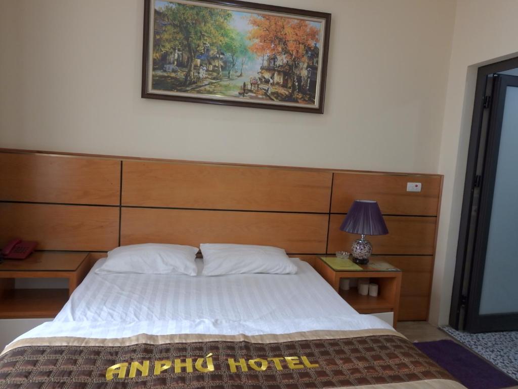 Postel nebo postele na pokoji v ubytování An Phú Nguyễn Hoàng Hotel