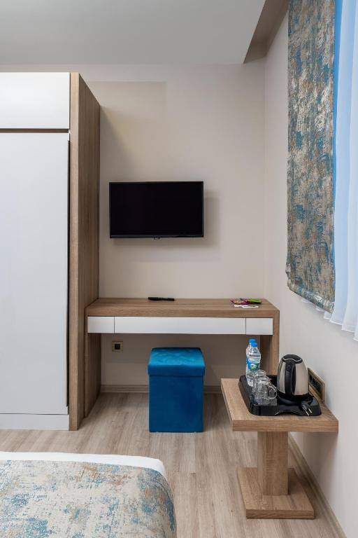TV a/nebo společenská místnost v ubytování Anelli Hotel