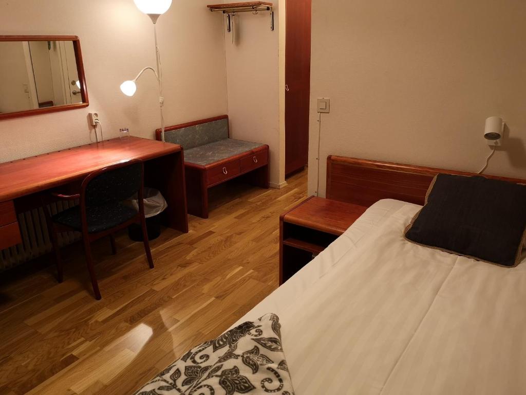 Postel nebo postele na pokoji v ubytování Hotell Åsen