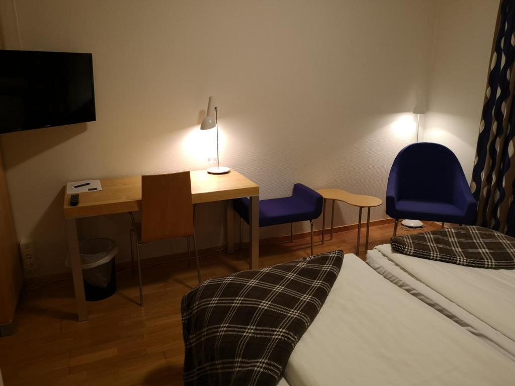 Postel nebo postele na pokoji v ubytování Hotell Åsen