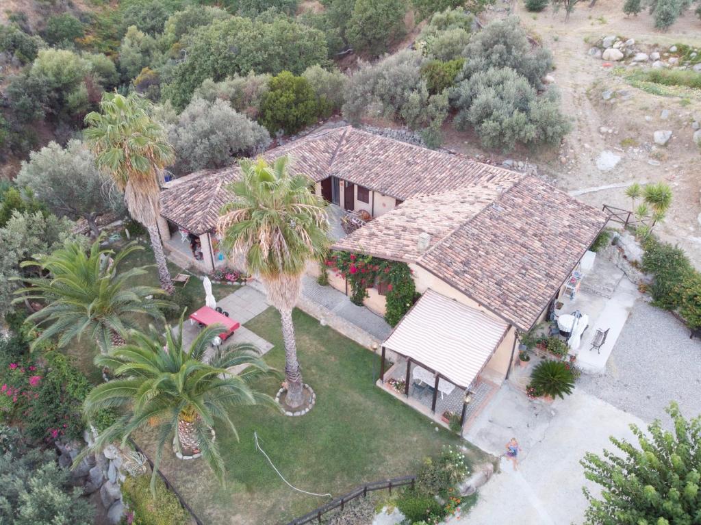 an overhead view of a house with palm trees at Villa Romeo - Alloggio Pastore - Private Pool in Santa Caterina dello Ionio
