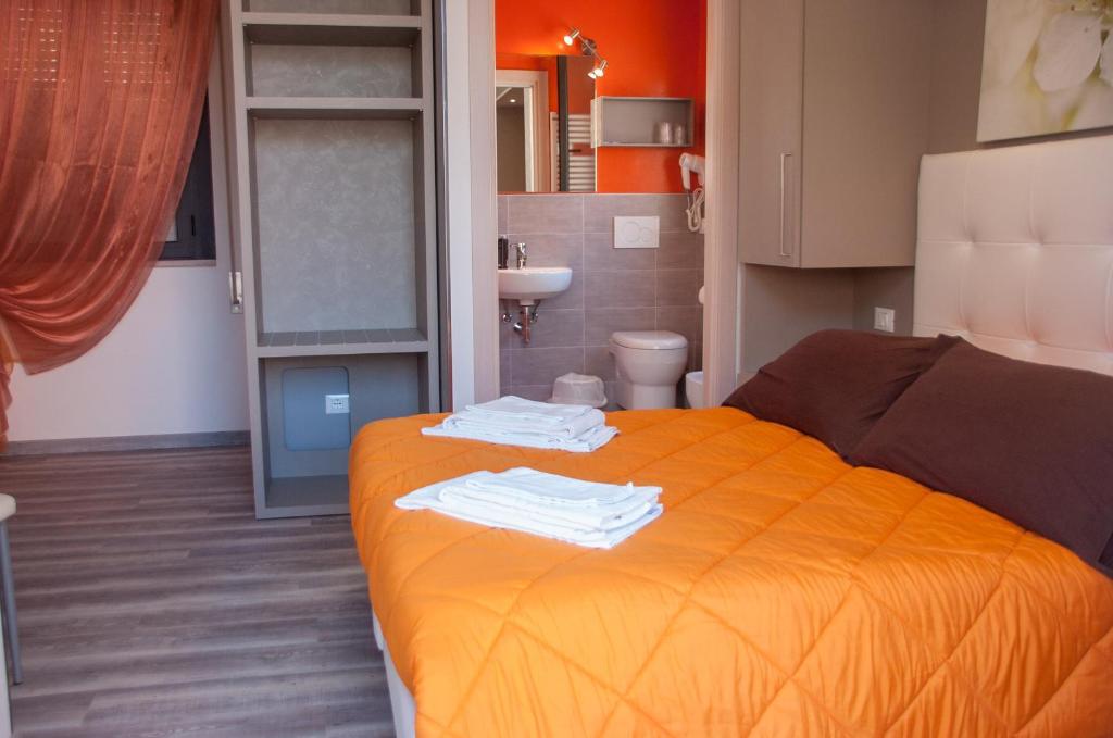 Postel nebo postele na pokoji v ubytování Albergo Villa Miraggio