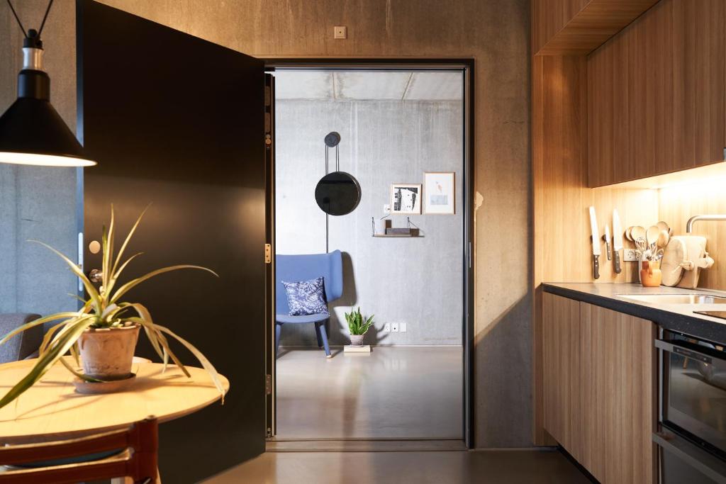 Kuchyň nebo kuchyňský kout v ubytování Hotel GUESTapart