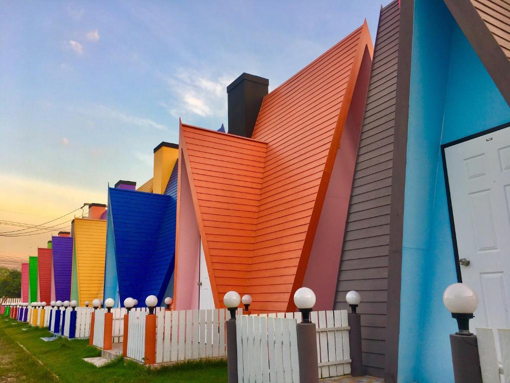 a building that is painted in different colors at Bangkado Resort in Ratchaburi