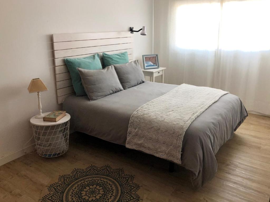A bed or beds in a room at Casa Capricho