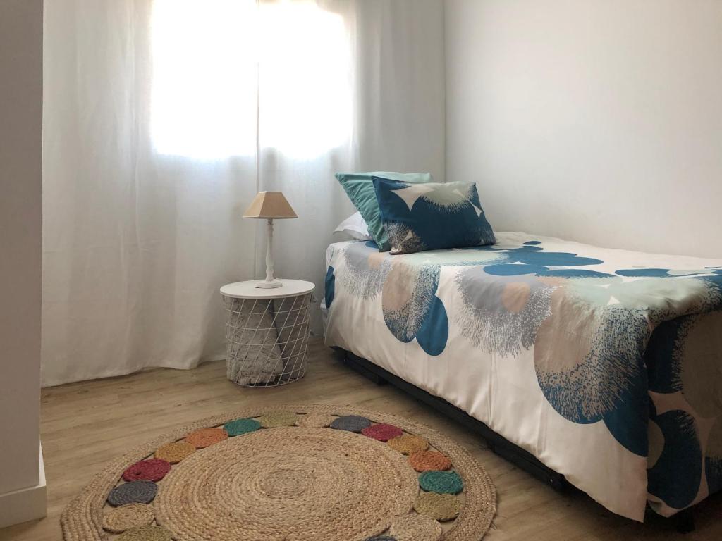 A bed or beds in a room at Casa Capricho
