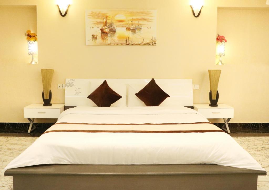 Postel nebo postele na pokoji v ubytování Rimal Suites Apartments