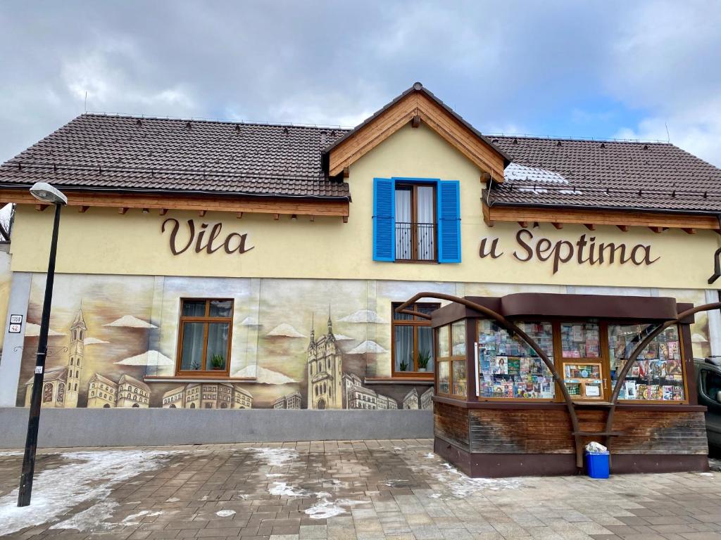 a building with a mural on the side of it at Vila U Septima in Poprad
