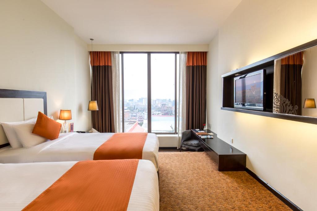 Postel nebo postele na pokoji v ubytování Hotel Himalaya