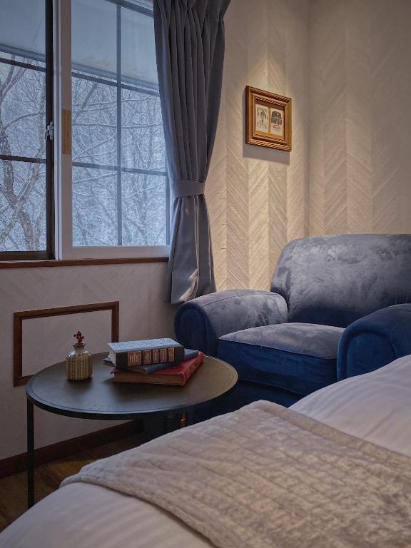 Postel nebo postele na pokoji v ubytování Apricot Pension