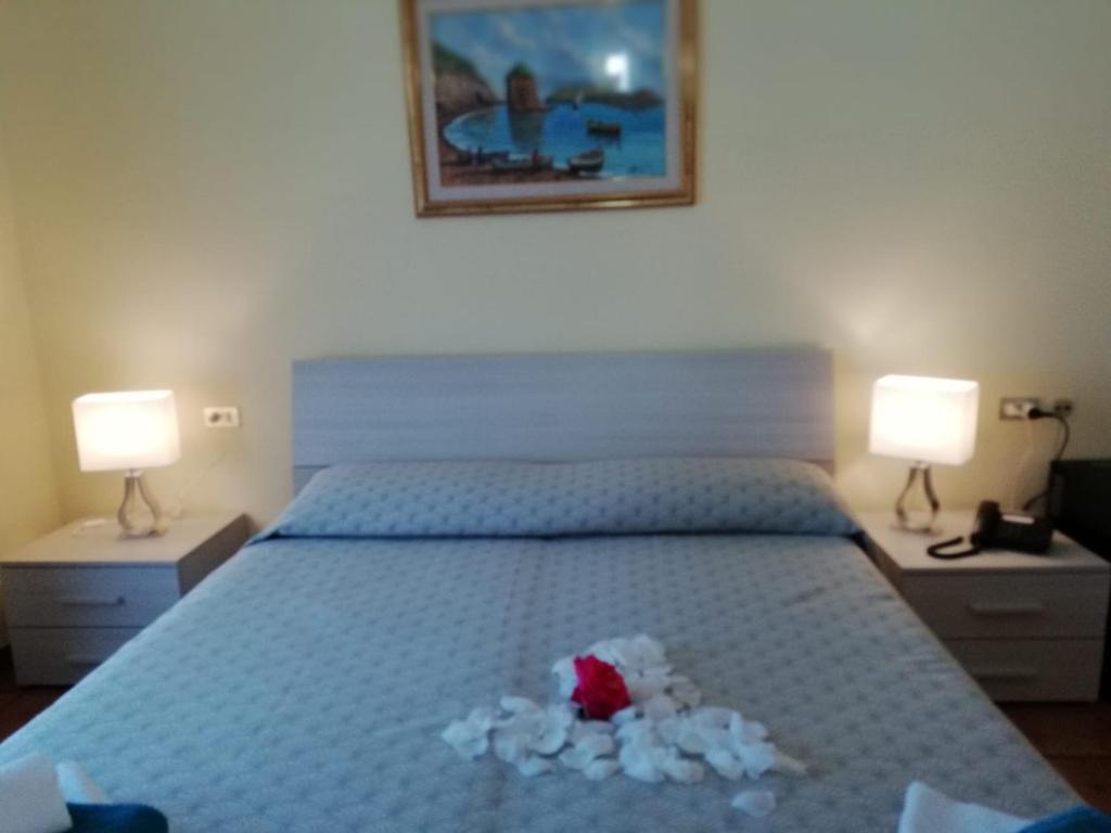 Postel nebo postele na pokoji v ubytování Hotel Calabattaglia