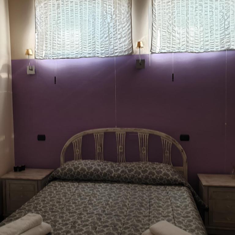Postel nebo postele na pokoji v ubytování B&B Il Rustico