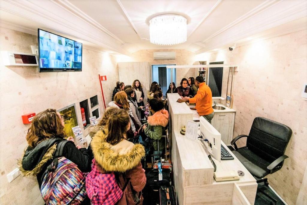 a group of people standing in a room at Hostel Beautiful in Rome